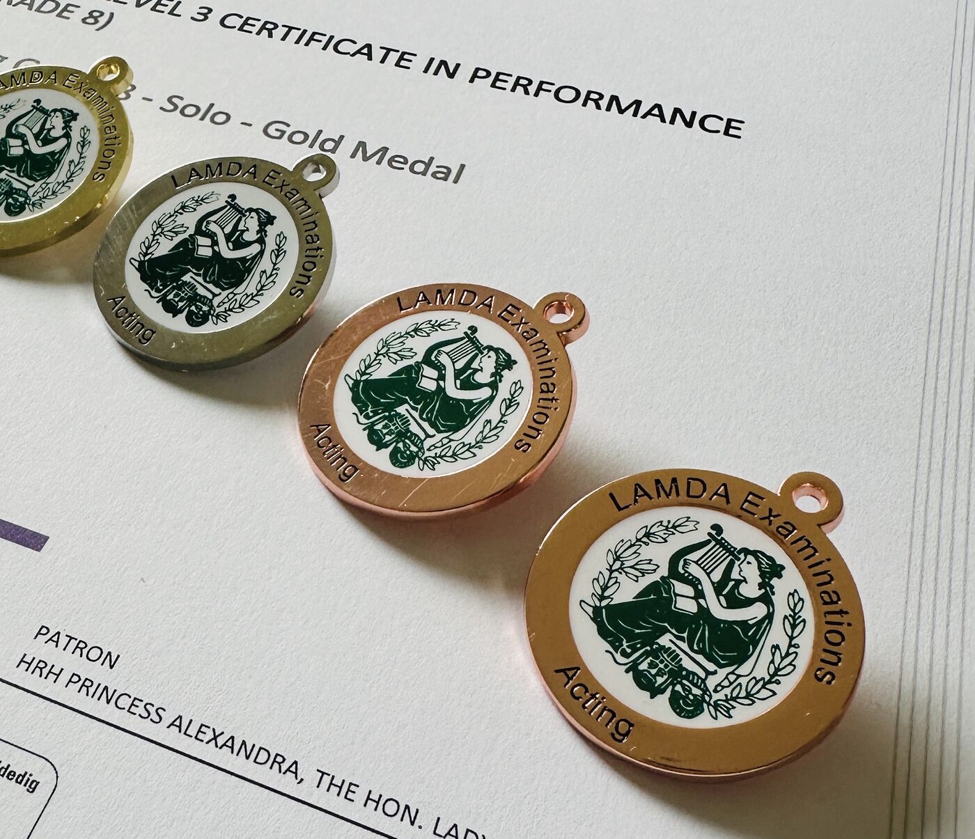 LAMDA Grade 8 Gold Medal certificate with acting medals